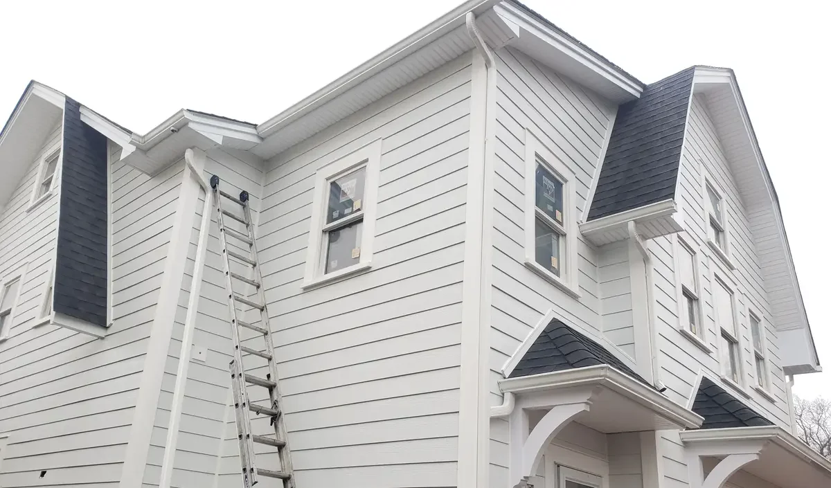 5-inch gutters with leaf guards - Need: 400x300px image of 5-inch gutters with protective leaf guard system
