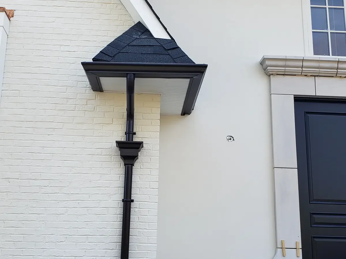 6-inch gutters on luxury estate - Need: 400x300px image of 6-inch gutters on upscale luxury home with complex roofline