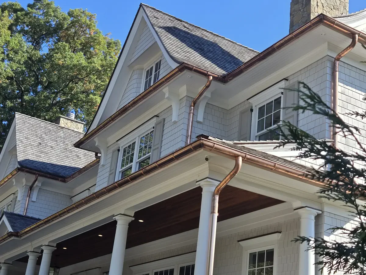 Copper gutter details - Need: 400x300px image showing copper gutter details, downspouts, or decorative elements