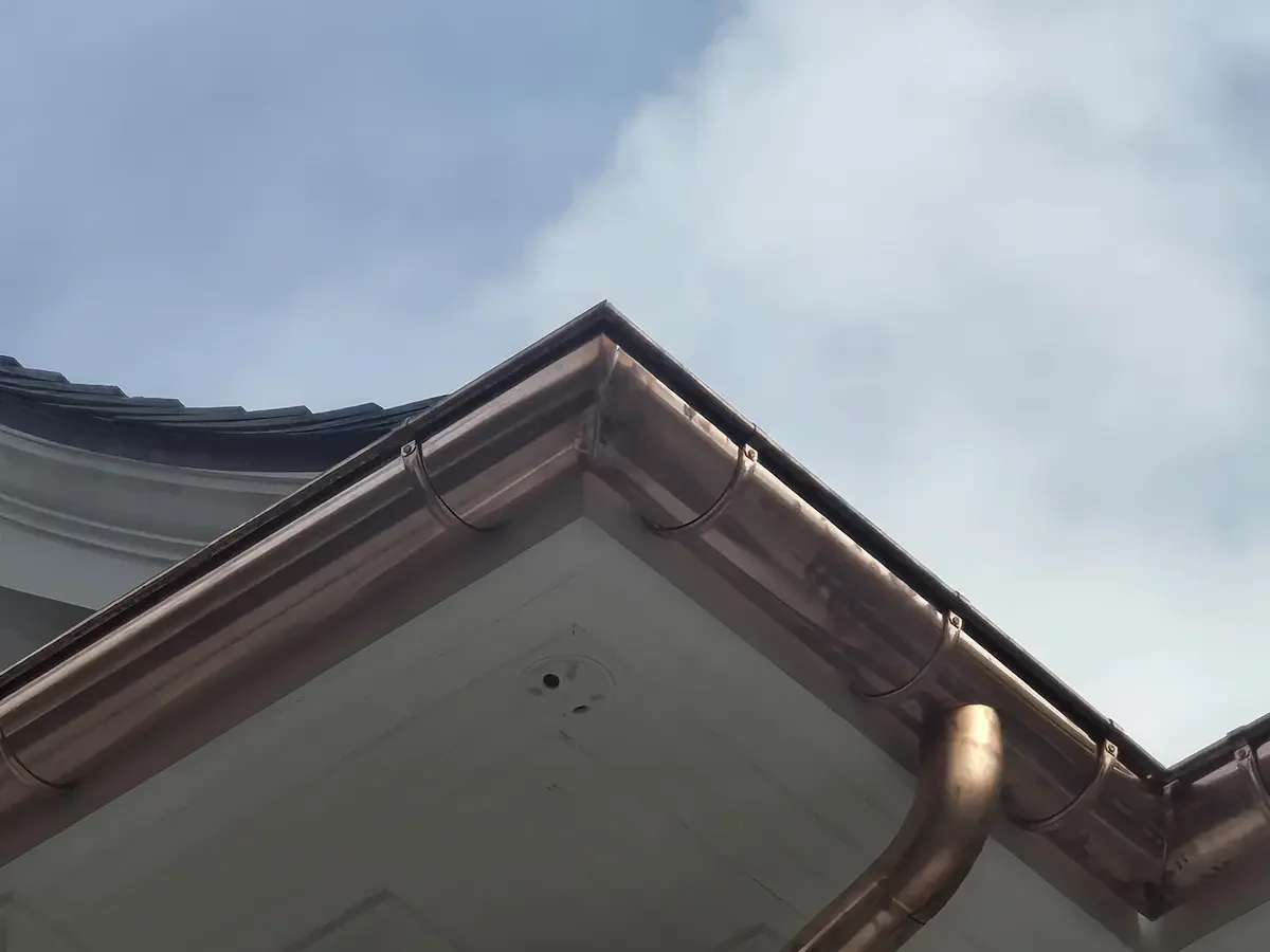 Developing patina copper gutters - Need: 400x300px image of copper gutters with green patina beginning to form